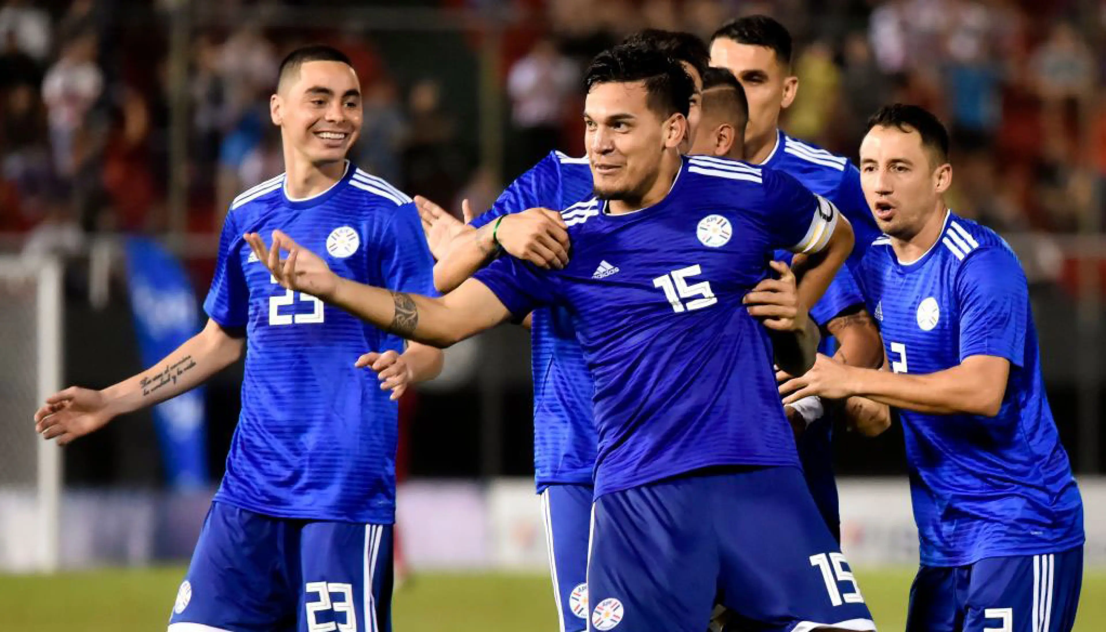 Paraguay players celebrate a goal
